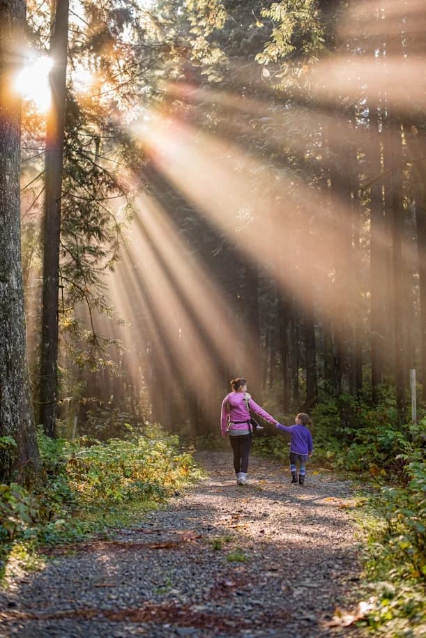 Woman with child in the forest